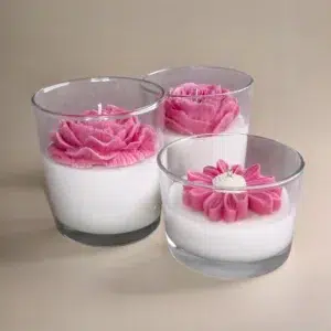 Hand-poured soy wax candles with flowers in glass vessels