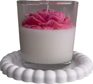 Decorative soy candle with wax flower in a glass container