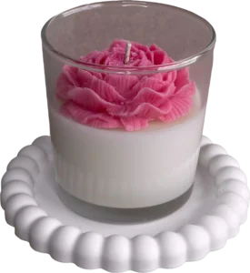 Handcrafted soy candle with flower in a decorative glass jar