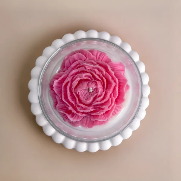 Close-up of handmade soy wax candle with flower detail