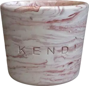 Handmade terracotta marble round candle in a Jesmonite vessel