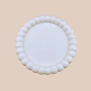 Handmade round tray in polymer plaster, customizable according to color choice.