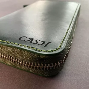 Green large leather wallet with personal engraving, front shown in detail