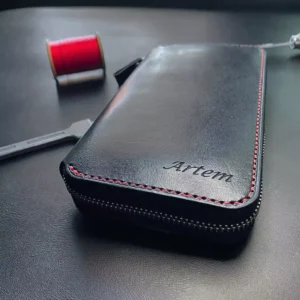 Black large leather wallet with personal engraving, shown from the front